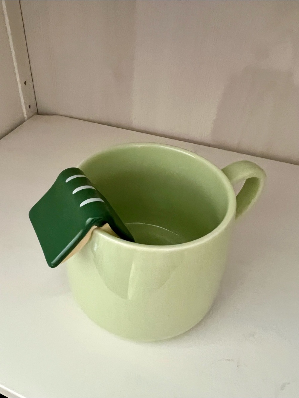Folded Book over the Rim Green Ceramic Mug